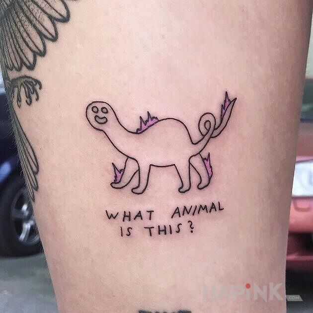Tattoo Zagadka in funny motif and ignorant style on the leg
