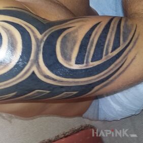 Tattoo Trbal on the upper arm style: tribal