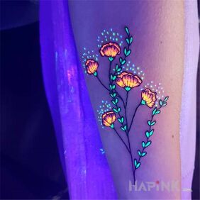 Tattoo Glowing flowers on the forearm motif: glow in the dark