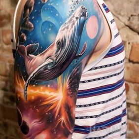 Tattoo Cetacean in space on the upper arm motif: cosmos