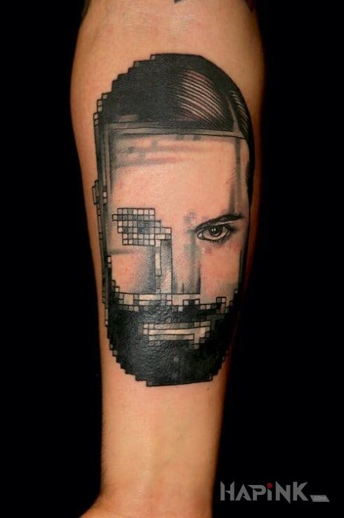 Tattoo Pikseloza na portrecie in faces motif and realistic style on the forearm