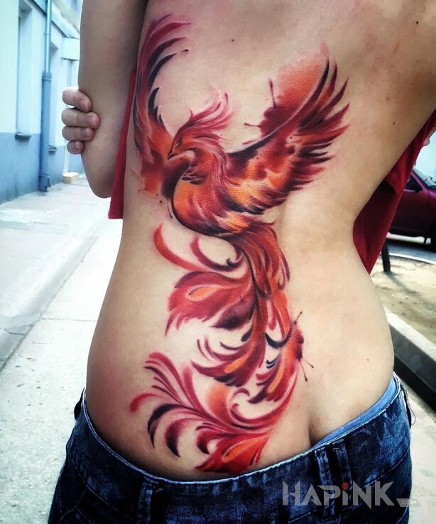 Tattoo Feniks in animals motif on the ribs