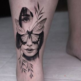Tatuaż Twarz w dwóch częściach na piszczeli motyw: twarze styl: surrealistyczne