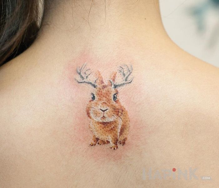 Tattoo Krolik in animals motif on the back