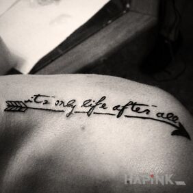 Tattoo Inscription and arrow on the collarbone motif: lettering