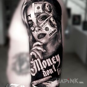 Tattoo Money don't lie :) on the upper arm motif: lettering style: realistic