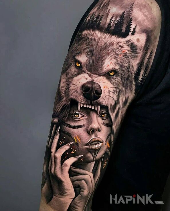 Tattoo Wilczyca in faces motif and realistic style on the upper arm