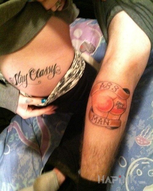 Tattoo Ass man in lettering motif on the leg