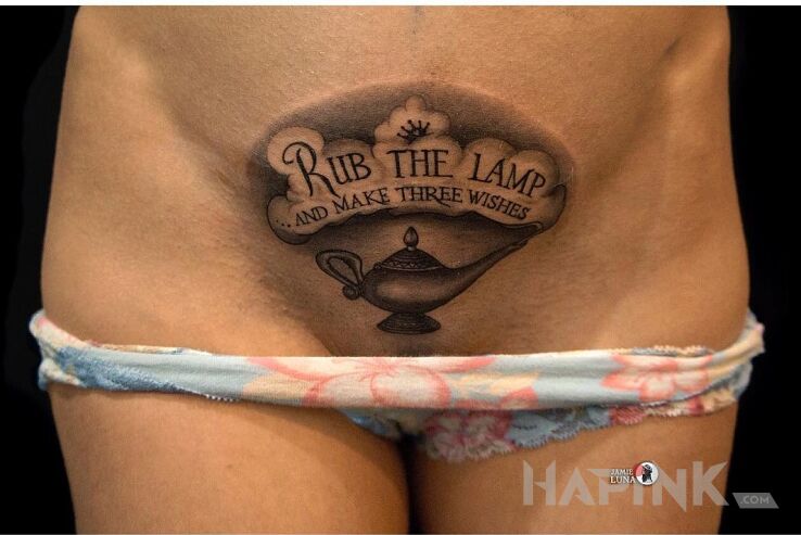 Tattoo Lampa alladyna ? in black and gray motif and calligraphy style on the stomach
