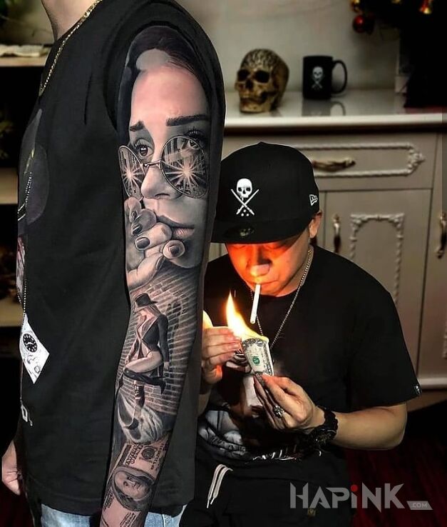 Tattoo Podparta o murek in faces motif and realistic style on the upper arm