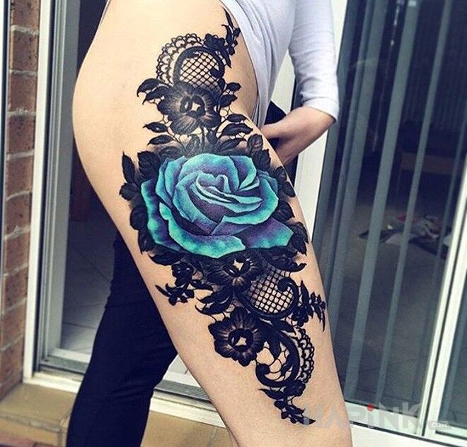 Tattoo Niebieska róża in colorful motif on the leg