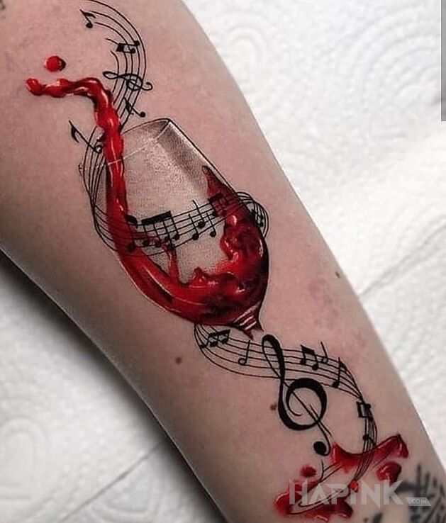 Tattoo Kieliszek wina in colorful motif and realistic style on the forearm