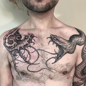 Tattoo Snakes on the chest on the upper arm motif: animals style: graphic / illustrative
