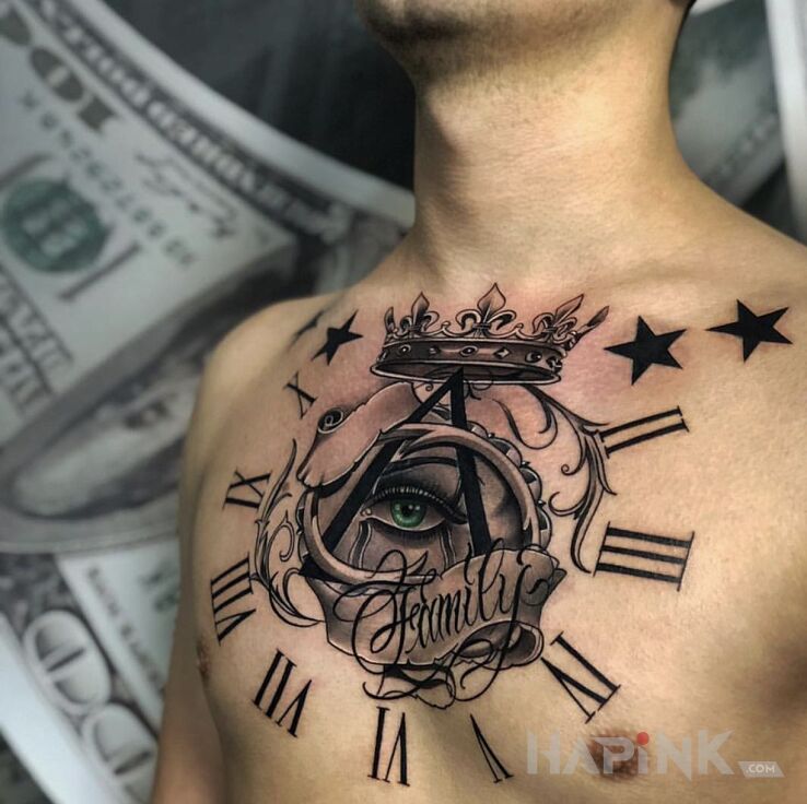 Tattoo Oko w koronie in black and gray motif and graphic / illustrative style on the chest