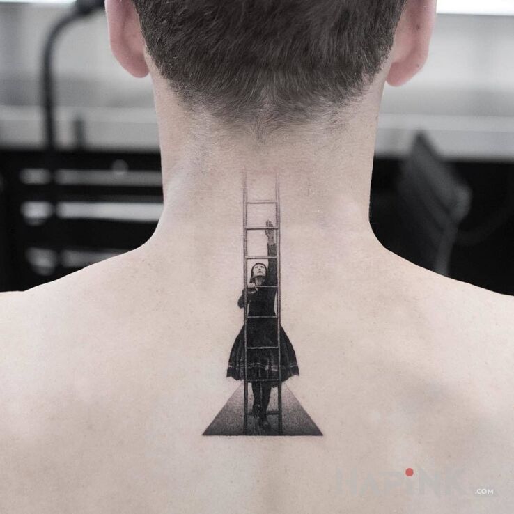 Tattoo Po drabinie do głowy in black and gray motif and graphic / illustrative style on the nape