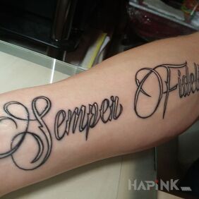 Tattoo Semper Fidelis on the forearm motif: lettering