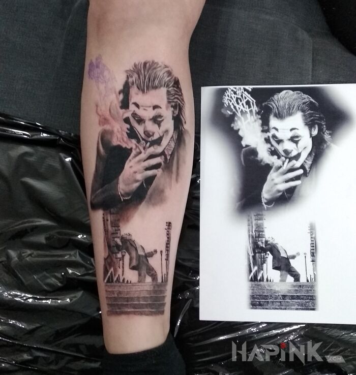 Tattoo Joker in faces motif and realistic style on the calf