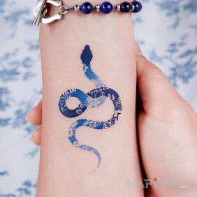 Tattoo Delicate little blue snake on the forearm motif: colorful style: graphic / illustrative
