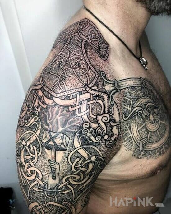 Tattoo Młot thora in ornaments motif and dotwork style on the shoulder