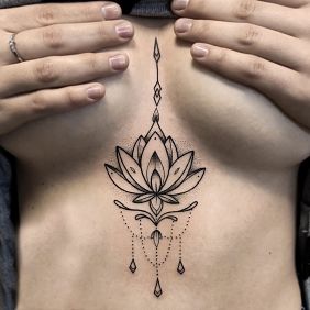 Tattoo Lotus flower underboob motif: ornaments style: graphic / illustrative