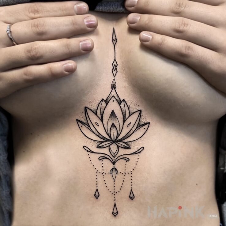 Tattoo Kwiat lotosu in flowers motif and graphic / illustrative style between the breasts