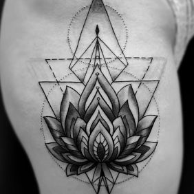 Tattoo Lotus flower geometry on the leg motif: black and gray style: geometric