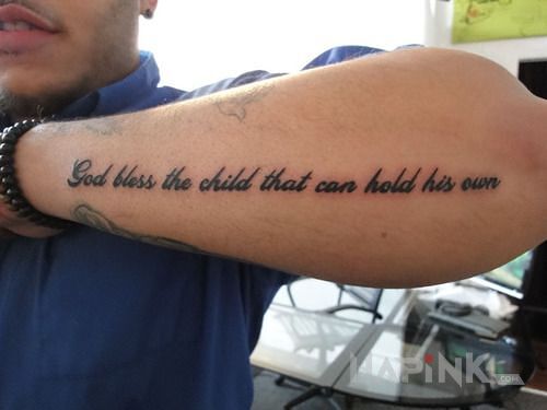 Tattoo Bóg i dziecko in religious motif and calligraphy style on the forearm