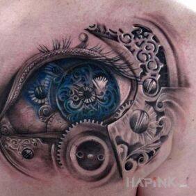Tattoo Steampunk eye on the shoulder blades motif: steampunk style: realistic