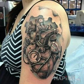 Tattoo Steam-powered heart on the upper arm motif: steampunk style: realistic