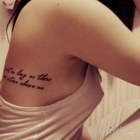 Tattoo Ribs inscription on the ribs motif: lettering