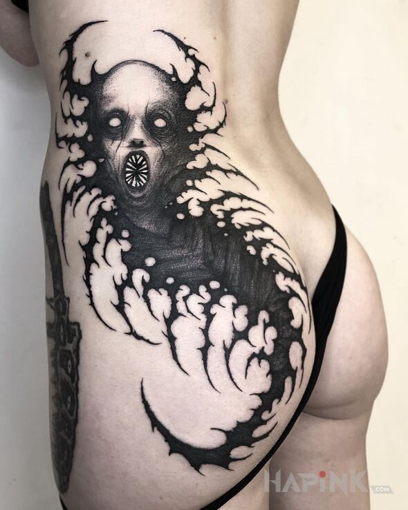 Tattoo Mroczny robaczek in dark motif and graphic / illustrative style on the buttocks