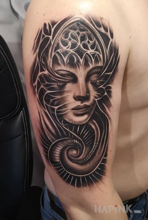Tattoo Dziara in Stained glass motif and realistic style On the arm