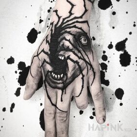 Tattoo A bit scary sight on the hand motif: black and gray style: graphic / illustrative