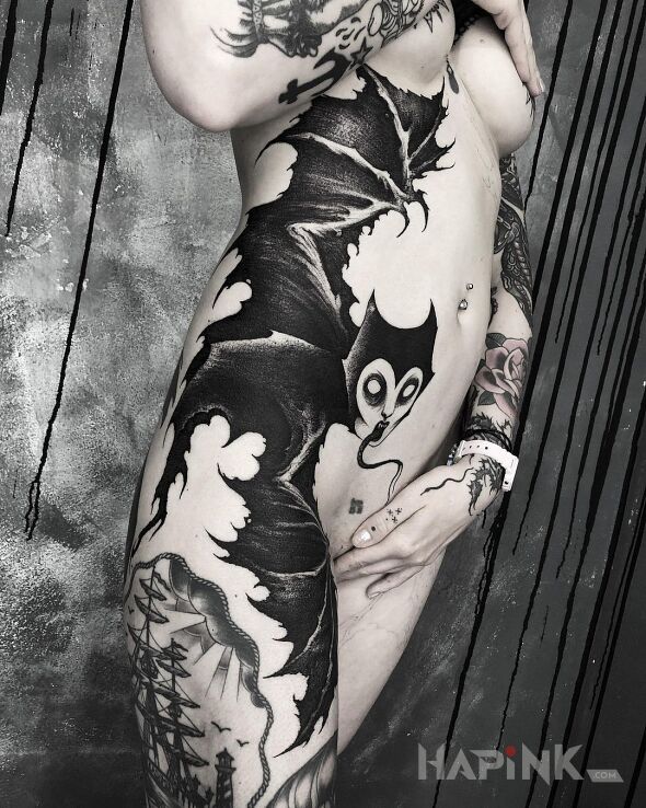 Tattoo Czarownica nietoperzyca :) in dark motif and blackwork / blackout style on the leg