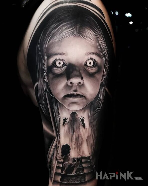 Tattoo Nawiedzona dziewczynka in demons motif and realistic style on the upper arm