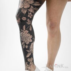Tattoo Flowers on black background on the thigh motif: legsleeves style: realistic