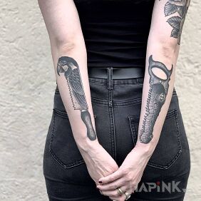 Tattoo Knife and saw, but animal? On the arm motif: animals style: graphic / illustrative