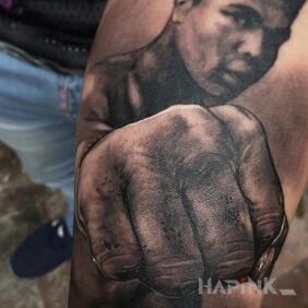 Tattoo Muhammad Ali on the forearm motif: characters style: realistic