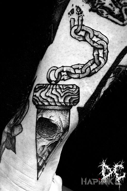 Tattoo Gilotyna in black and gray motif and dotwork style on the leg