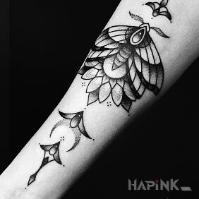 Tattoo Moth with ornaments On the arm motif: butterflies style: graphic / illustrative
