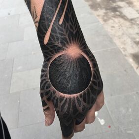 Tattoo Black something on the wrist motif: other style: blackwork / blackout