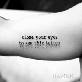 Tattoo Close your eyes on the upper arm motif: lettering