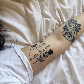 Tattoo Girl is a gun on the forearm motif: flowers style: contour / linework