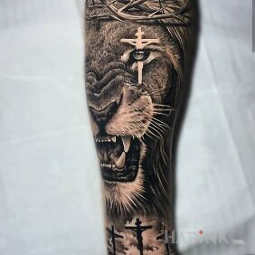 Tattoo Lion in a crown of thorns on the forearm motif: religious style: realistic