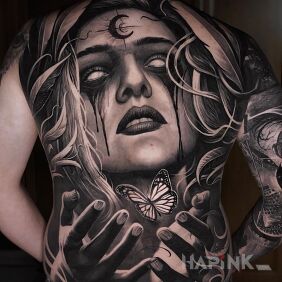 Tattoo Butterfly and a scary girl on the back motif: faces style: realistic