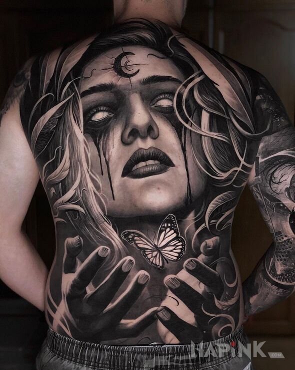 Tattoo Motyl i przerazajaca laska in black and gray motif and realistic style on the shoulder blades