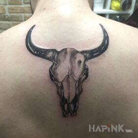 Tattoo Zodiac sign on the back motif: black and gray style: realistic