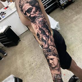 Tattoo Ancient vibes on the upper arm motif: faces style: realistic