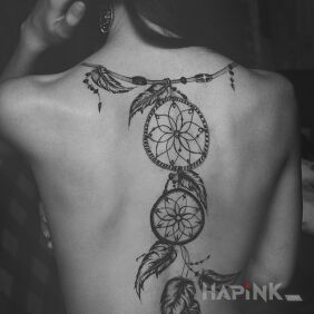Tattoo Wonder catcher on the back motif: black and gray style: realistic