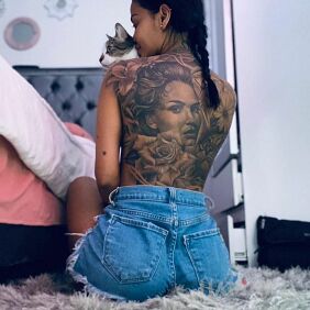 Tattoo Large size portrait on the shoulder blades motif: faces style: realistic